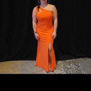 Bright orange one shoulder gown